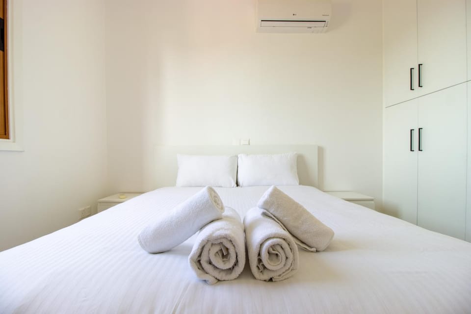 Bed, Bedroom, towels, wardrobe, air conditioner