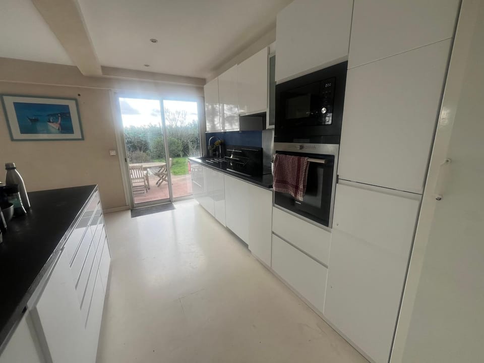 Kitchen or kitchenette, dishwasher, oven, stove
