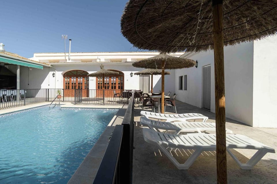Property building, Patio, Day, View (from property/room), Pool view, Swimming pool, sunbed