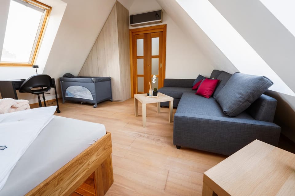Seating area, cot, wardrobe