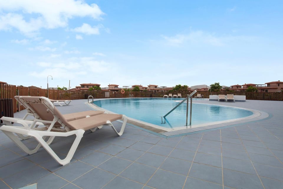 Property building, Living room, Swimming pool