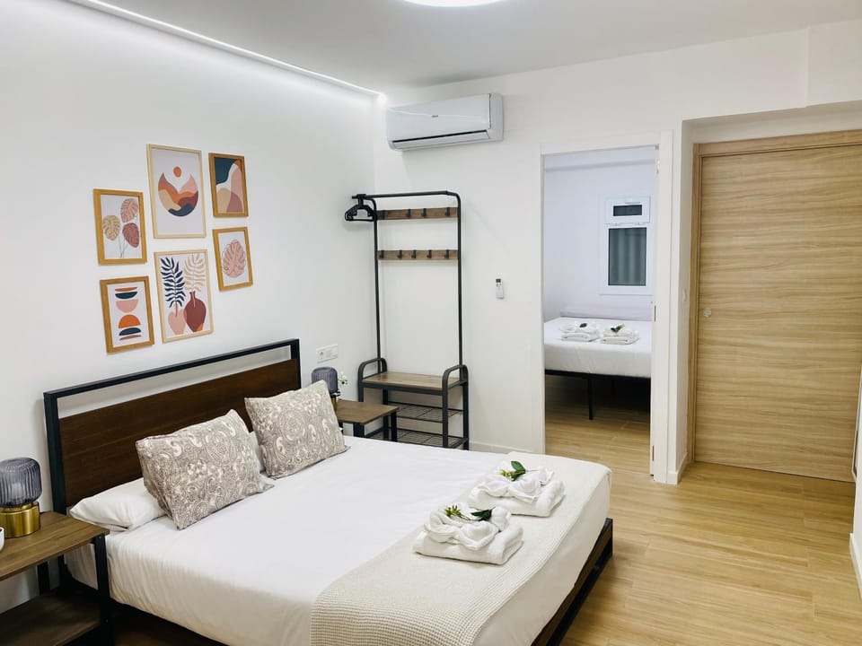 Bed, Photo of the whole room, Bedroom, towels, air conditioner