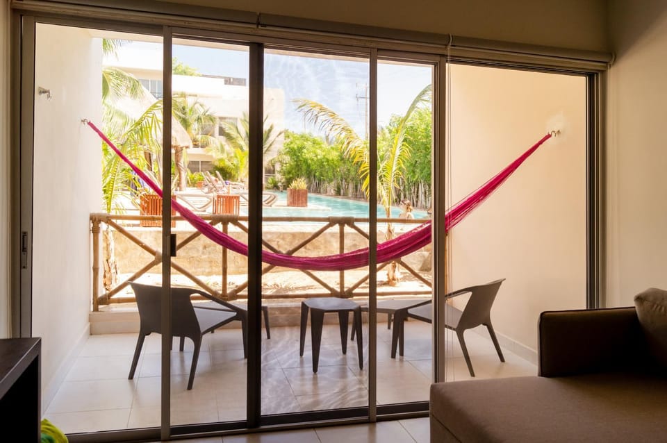 Patio, View (from property/room), Balcony/Terrace, Living room, Seating area, Pool view, Swimming pool, sunbed