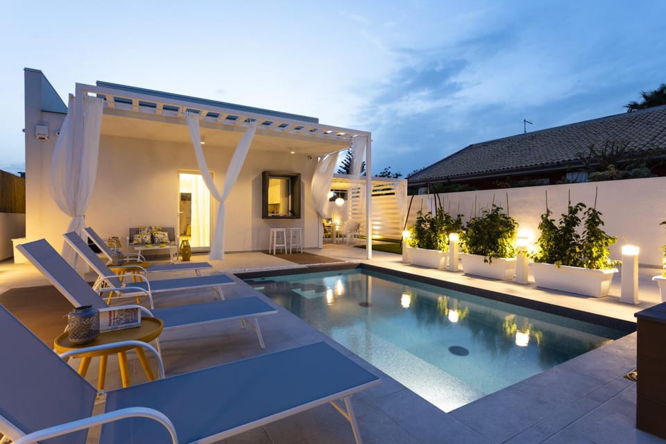 Property building, Patio, Night, Natural landscape, Pool view, Swimming pool