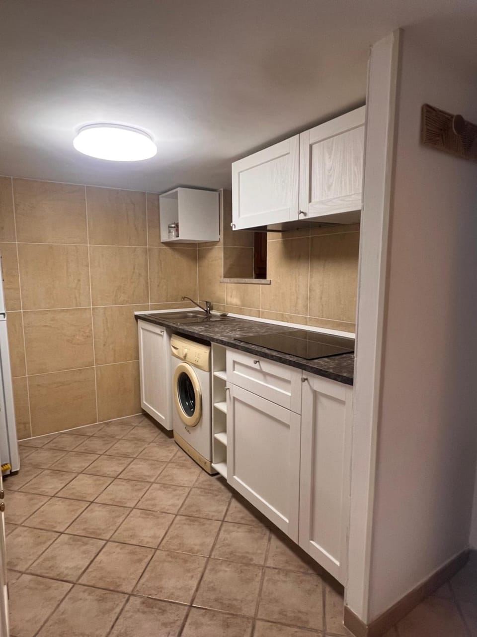 Kitchen or kitchenette, stove, washing machine