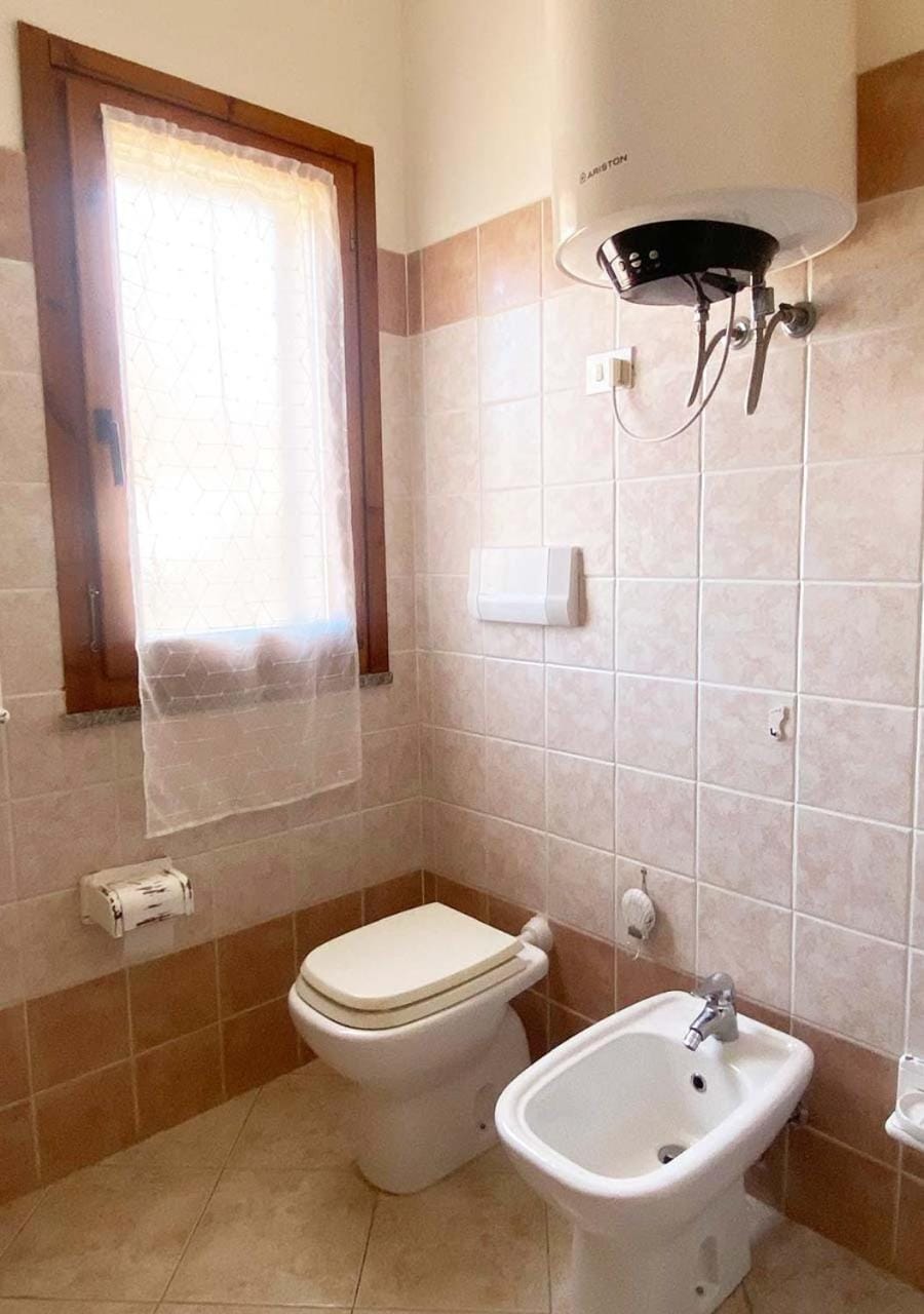 Shower, Toilet, Bathroom, hair dryier, towels