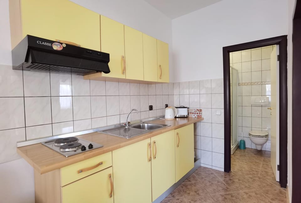 Kitchen or kitchenette, stove