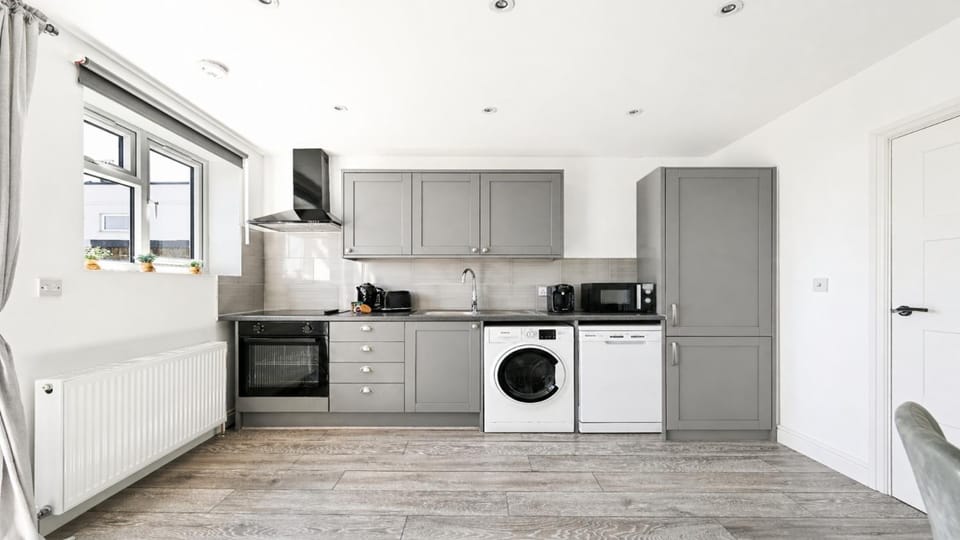 Kitchen or kitchenette, dishwasher, oven, stove, washing machine