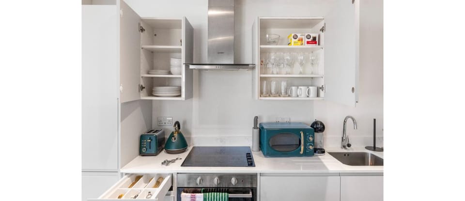 Kitchen or kitchenette, microwave, oven, stove, toaster