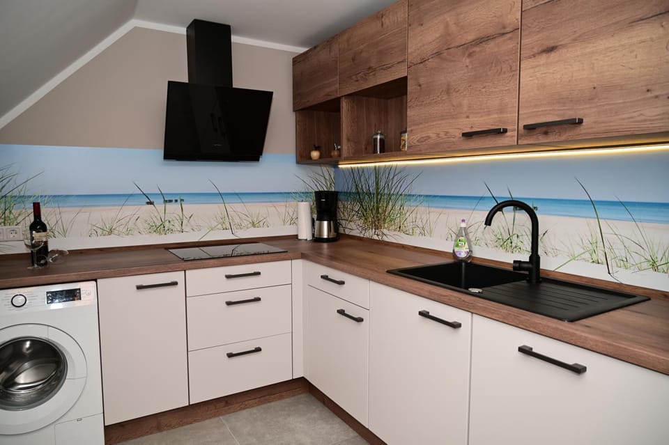 Kitchen or kitchenette, dishwasher, stove, washing machine