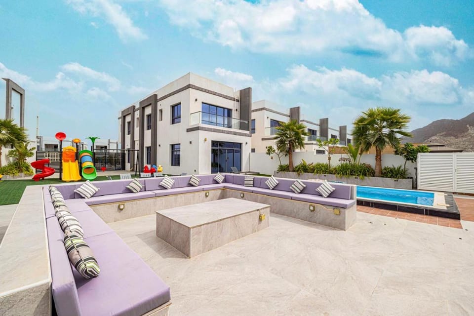 Property building, Patio, Communal lounge/ TV room, Day, Natural landscape, Children play ground, Garden, Living room, Seating area, Evening entertainment, Garden view, Pool view, Swimming pool, sunbed