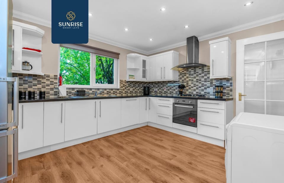 Kitchen or kitchenette, dishwasher, oven, stove