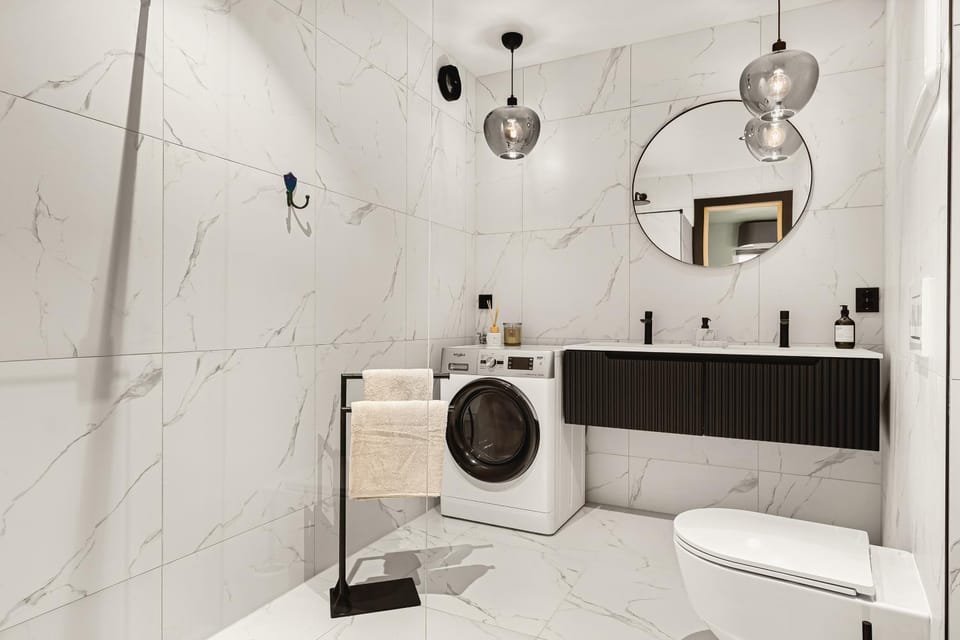 Shower, Toilet, Bathroom, towels, washing machine, dryer