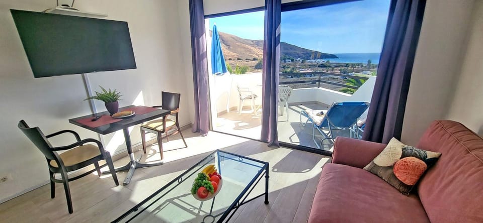 View (from property/room), Balcony/Terrace, Living room, Seating area, Dining area, Mountain view