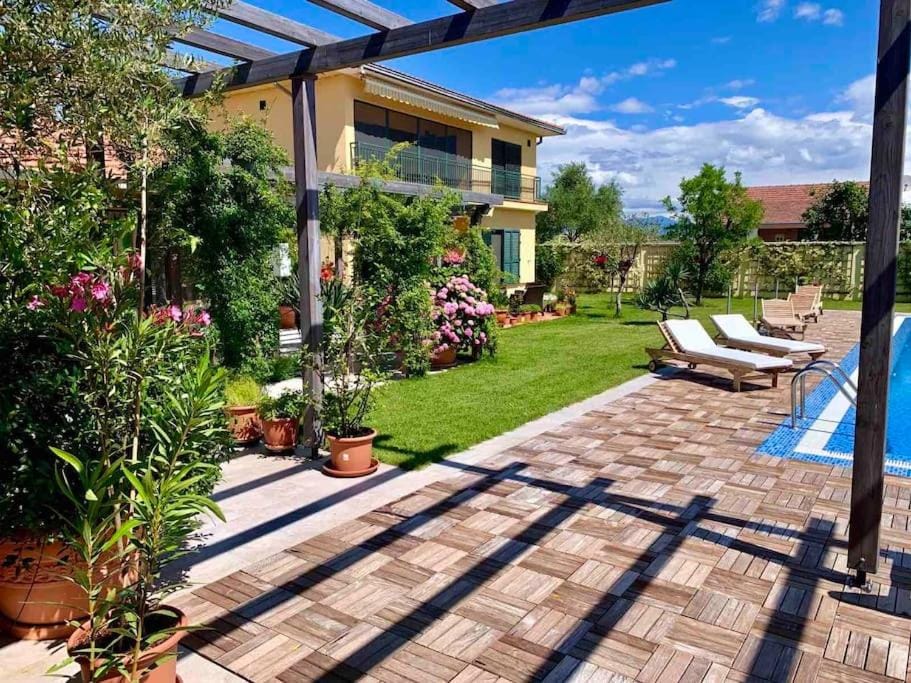 Property building, Patio, Pool view, Swimming pool, sunbed