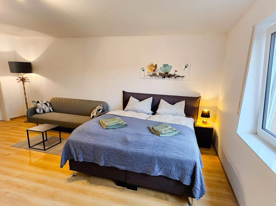 Bed, Living room, Seating area, Bedroom