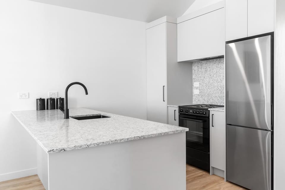 Kitchen or kitchenette, dishwasher, oven, stove