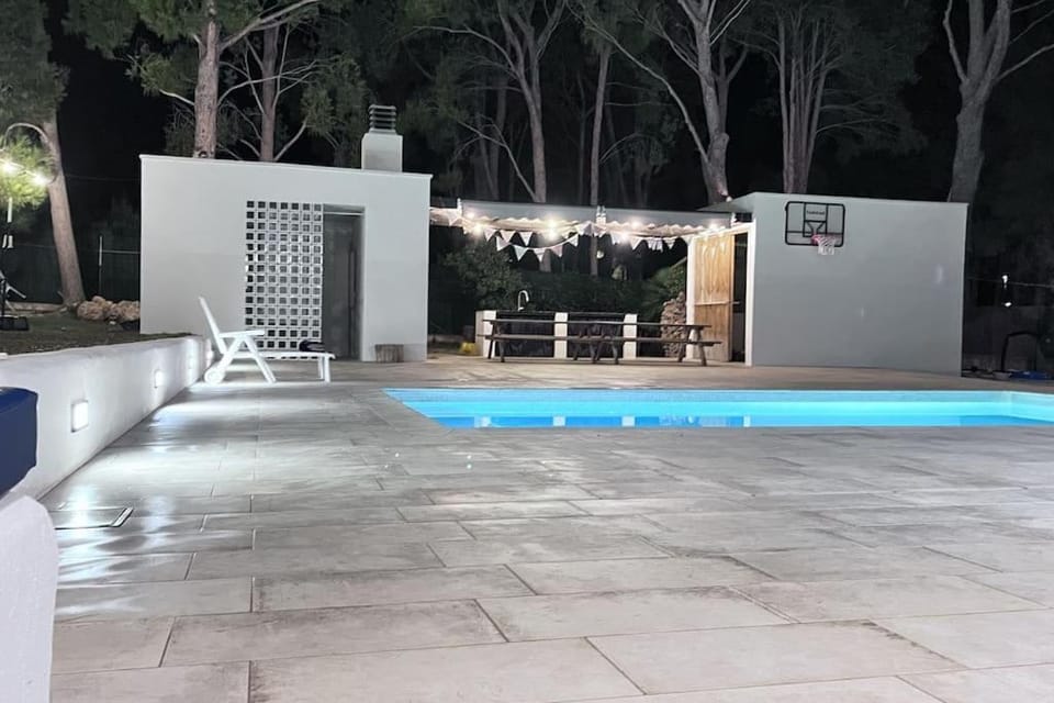 Property building, Night, Pool view, Swimming pool, sunbed