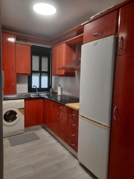 Kitchen or kitchenette, minibar, stove, washing machine