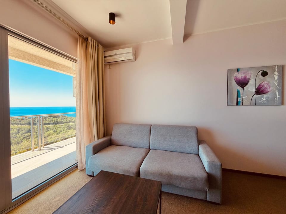 View (from property/room), Living room, Seating area, Sea view