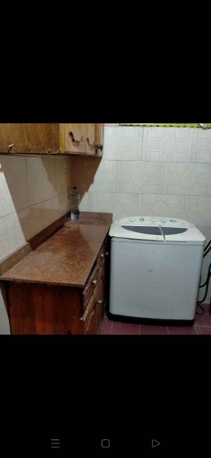 Kitchen or kitchenette, washing machine