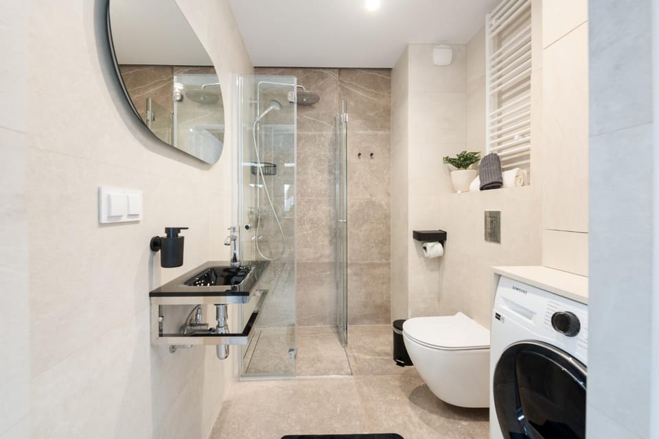 Shower, Toilet, Bathroom, towels, washing machine, dryer