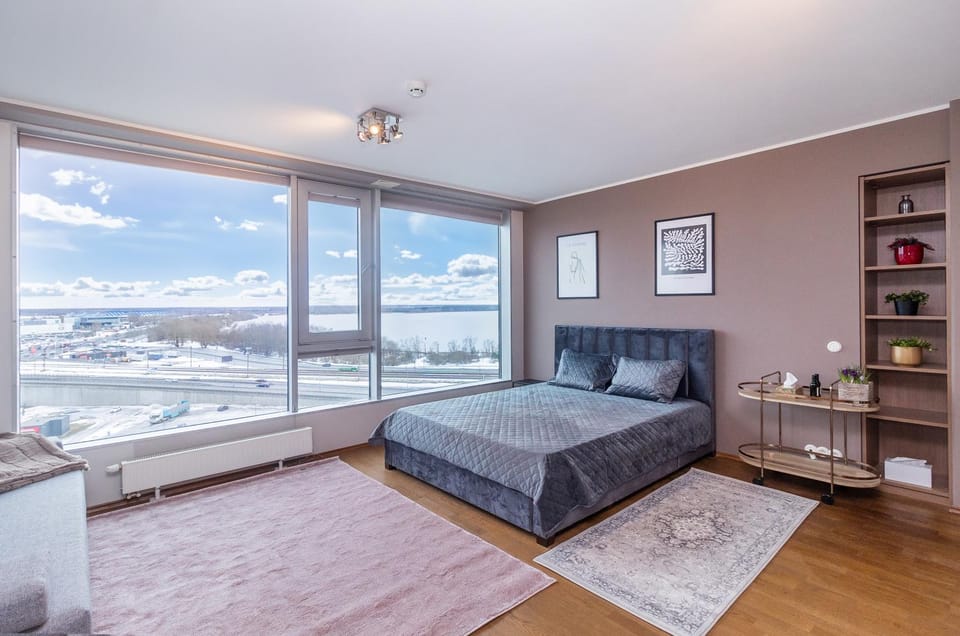 Bed, Natural landscape, Seating area, Bedroom, Lake view