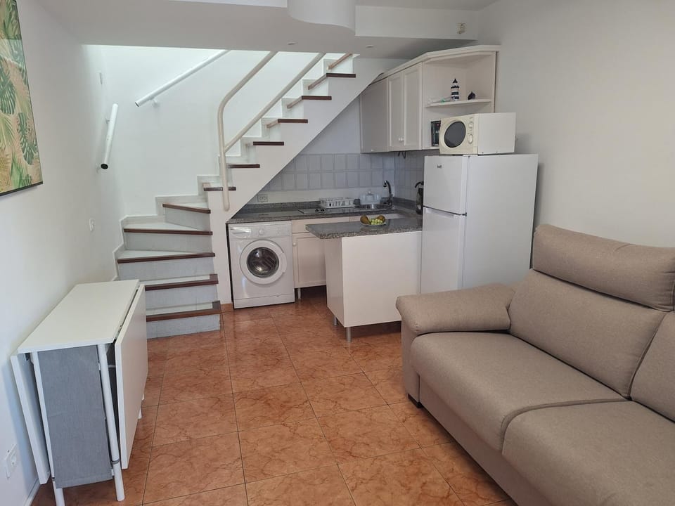 Kitchen or kitchenette, Living room, Seating area, stove, washing machine