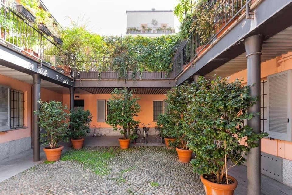 Elegant Triplex Townhouse with Luxe Terrace Apartment in Milan