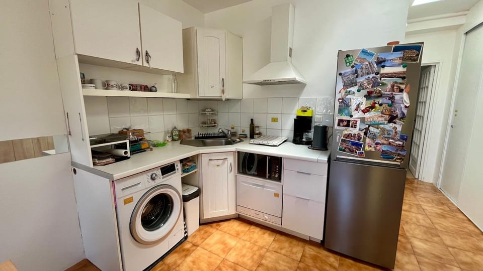 Kitchen or kitchenette, dishwasher, oven, stove, washing machine