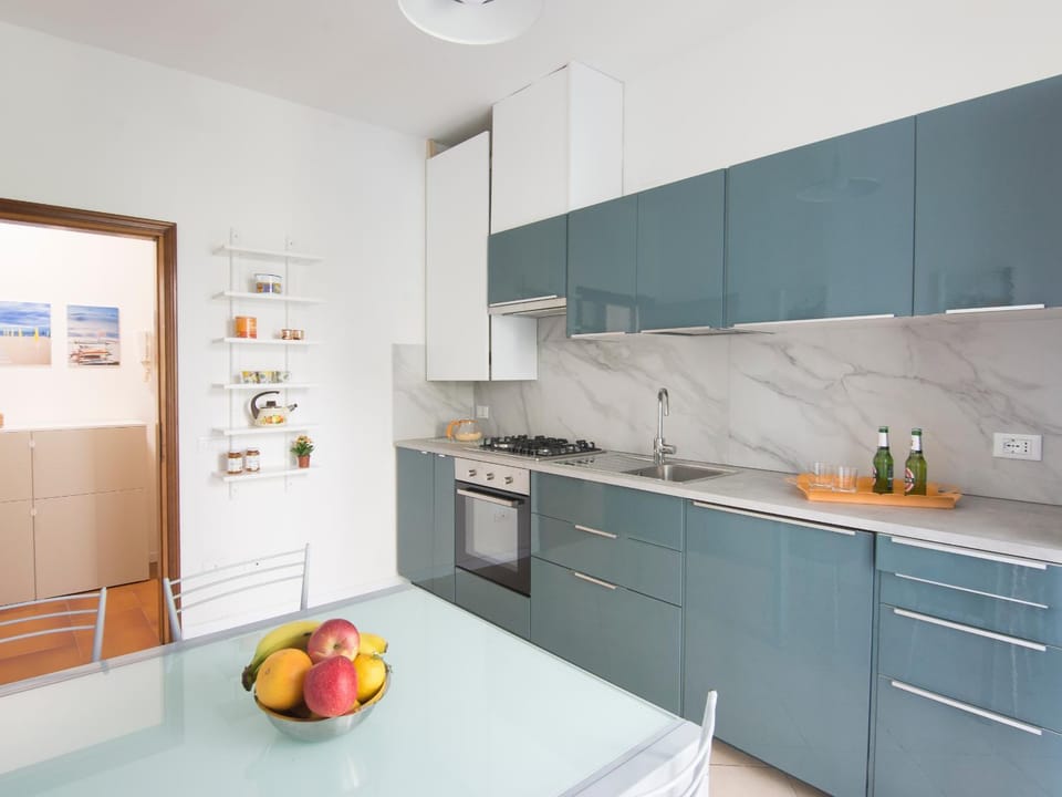 Kitchen or kitchenette, dishwasher, oven, stove