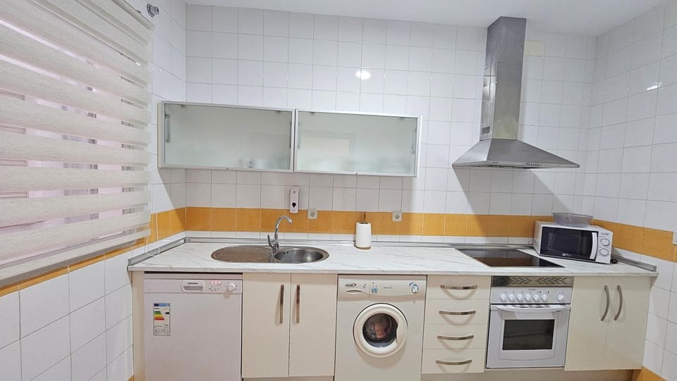 Kitchen or kitchenette, dishwasher, stove, washing machine