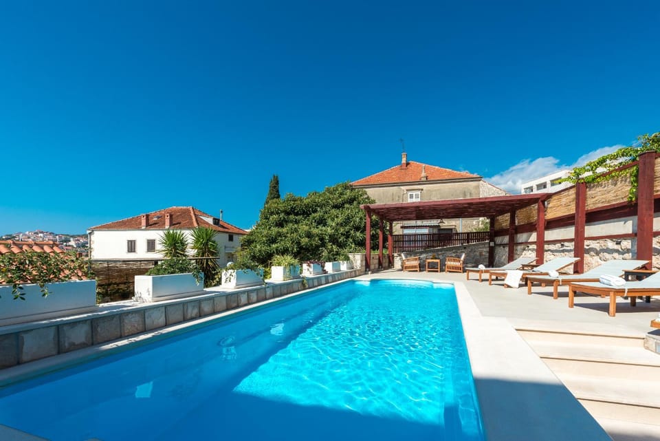 Property building, Natural landscape, Pool view, Swimming pool, sunbed