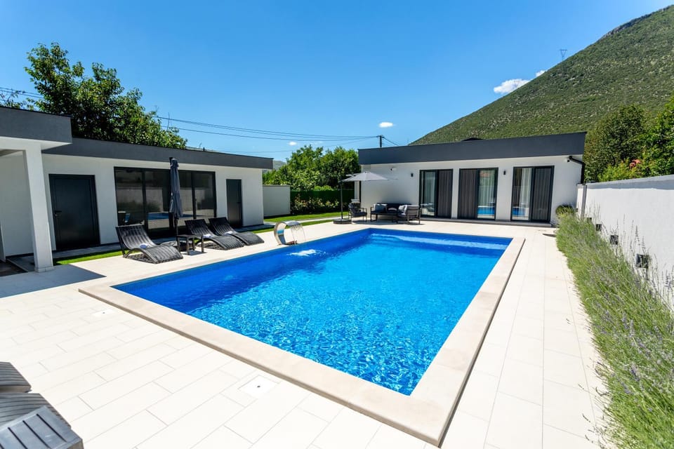 Property building, Patio, Natural landscape, Mountain view, Pool view, Swimming pool, sunbed