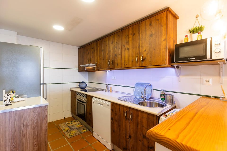 Kitchen or kitchenette, dishwasher, oven, stove