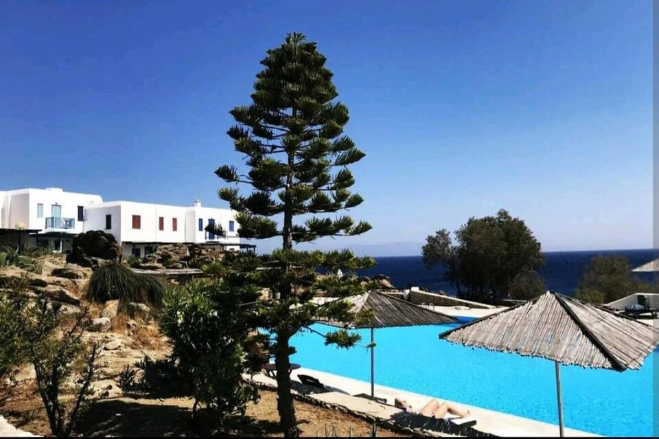 Property building, Nearby landmark, Day, Natural landscape, Pool view, Sea view, Swimming pool, Swimming pool, sunbed