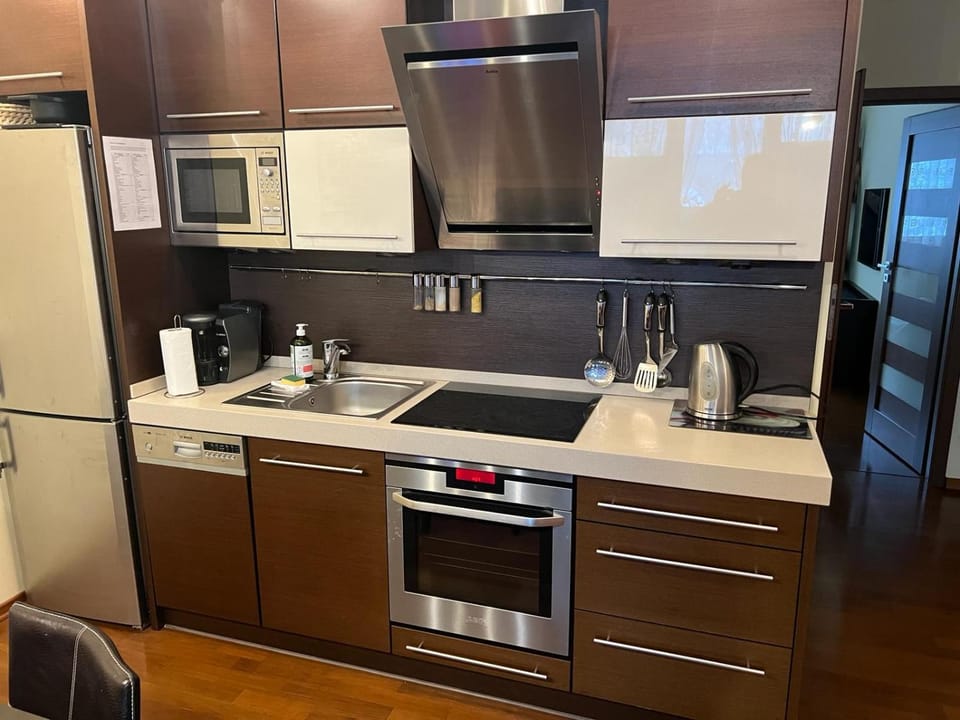 Kitchen or kitchenette, dishwasher, oven, stove