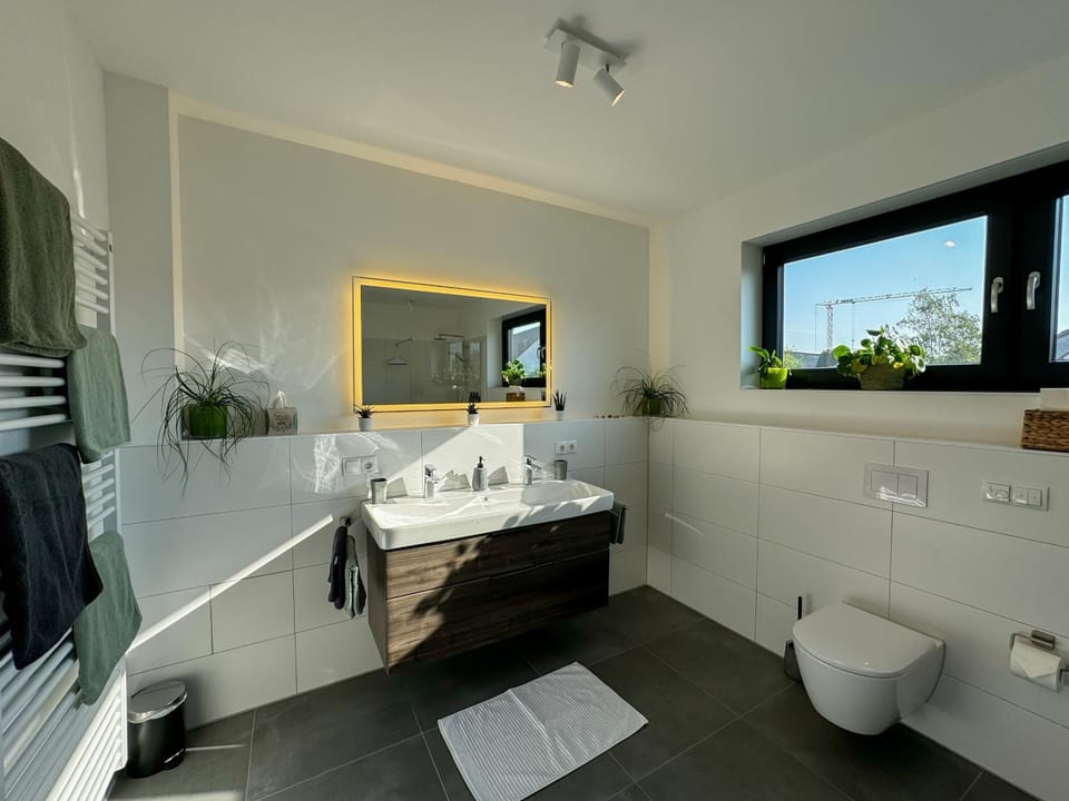Toilet, Bathroom, hair dryier, towels