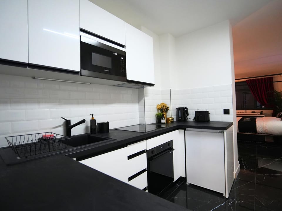 Kitchen or kitchenette, oven, stove, toaster
