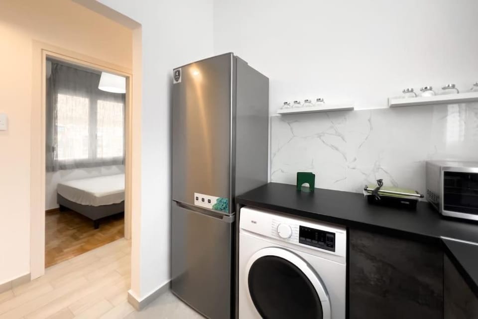Kitchen or kitchenette, washing machine