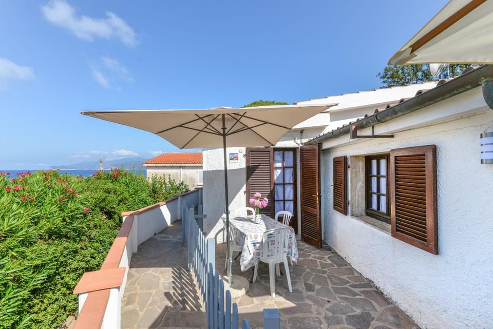 Property building, Patio, Day, Natural landscape, View (from property/room), Dining area, Sea view