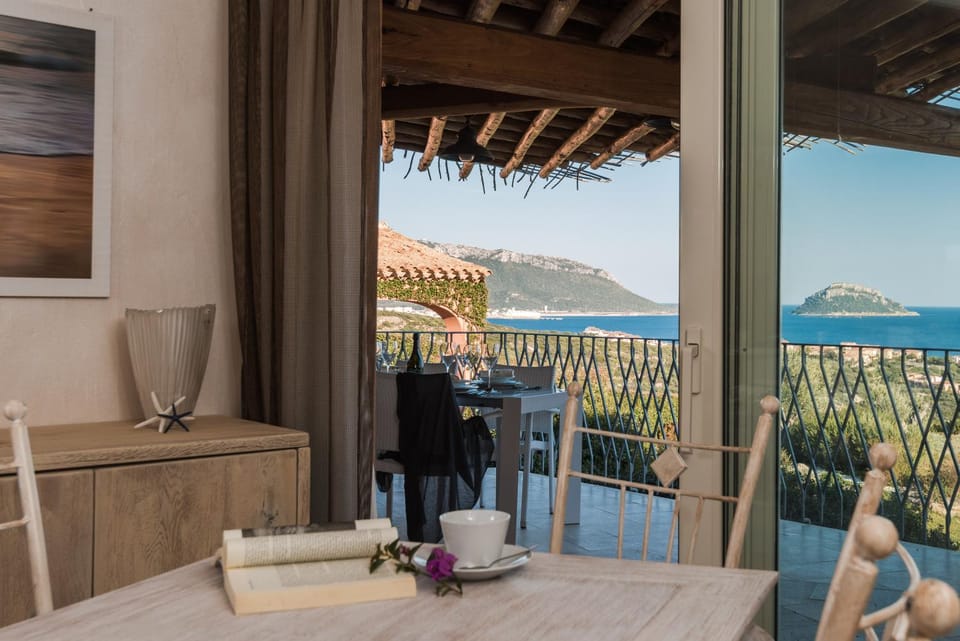 Natural landscape, View (from property/room), Living room, Seating area, Dining area, Sea view