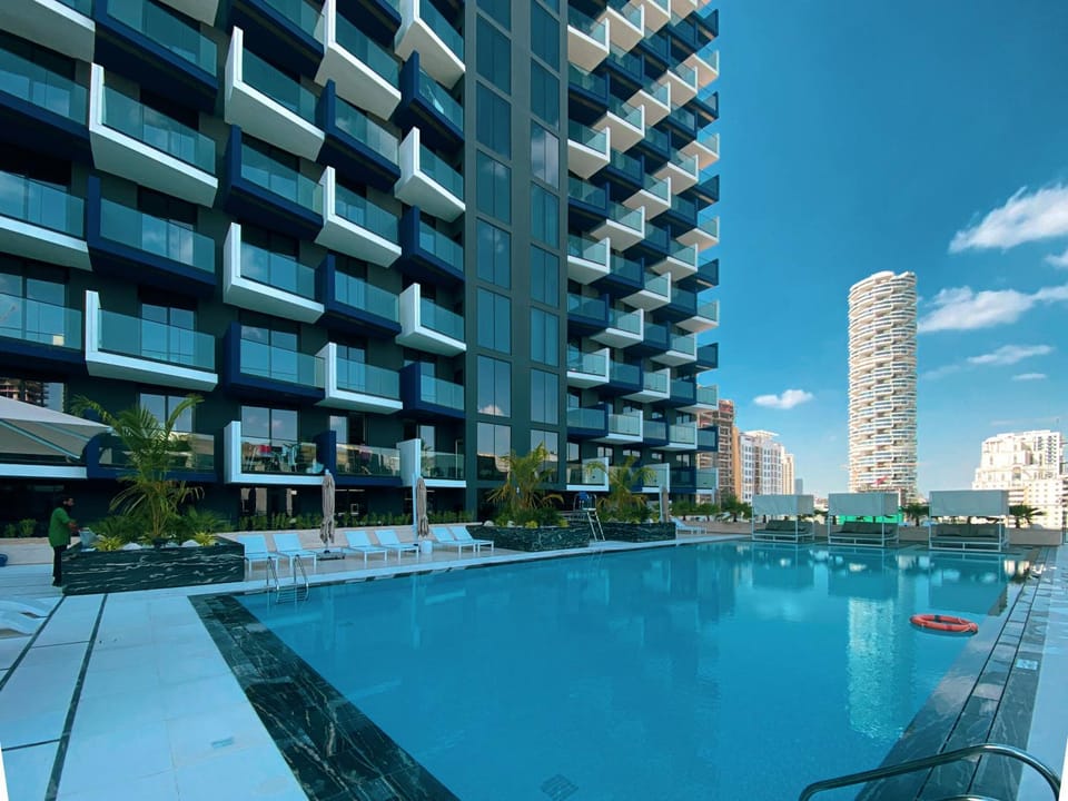Property building, Day, Pool view, Swimming pool, sunbed