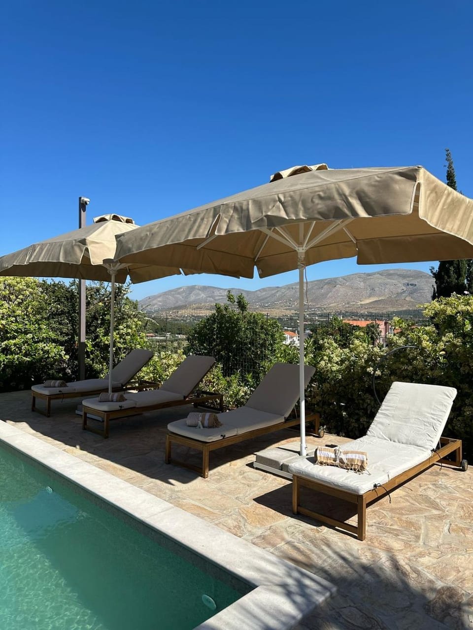 Patio, Day, Natural landscape, Pool view, Swimming pool, sunbed