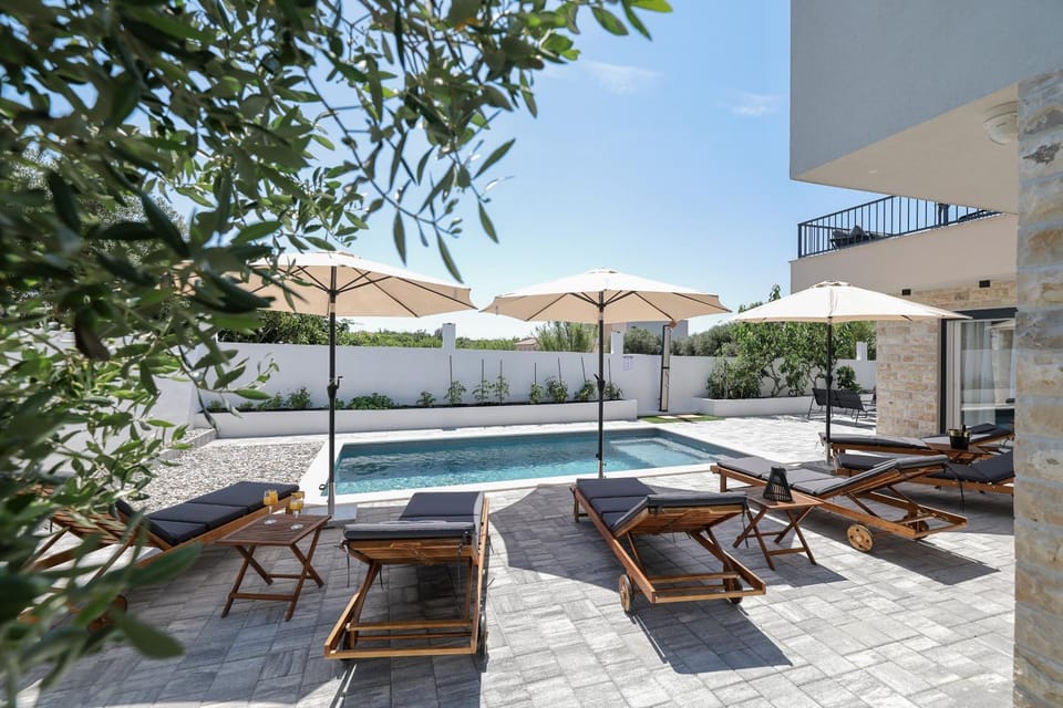 Property building, Day, Natural landscape, Pool view, Swimming pool, sunbed