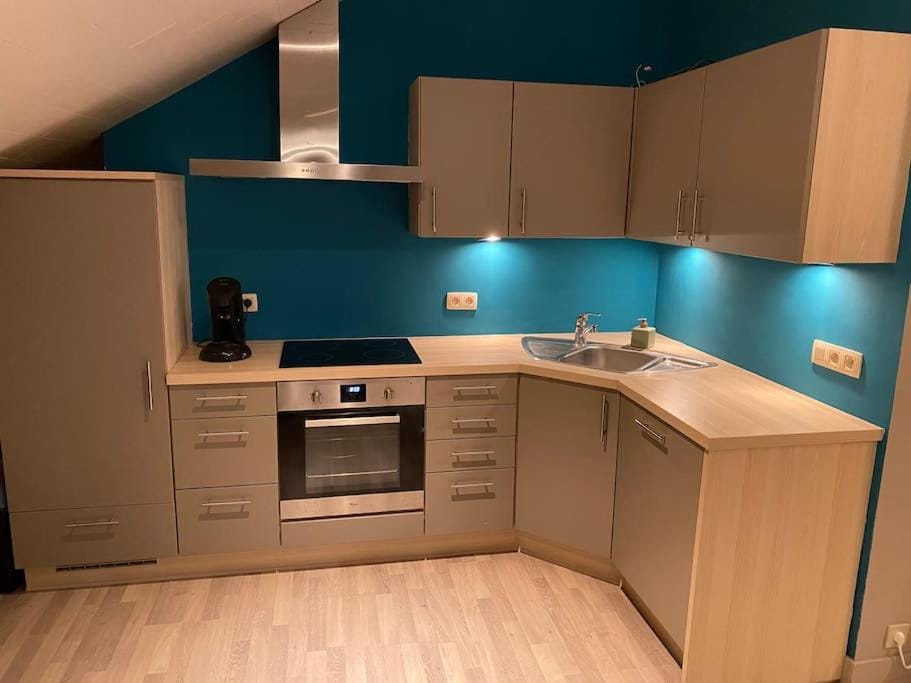 Kitchen or kitchenette, dishwasher, microwave, oven, stove