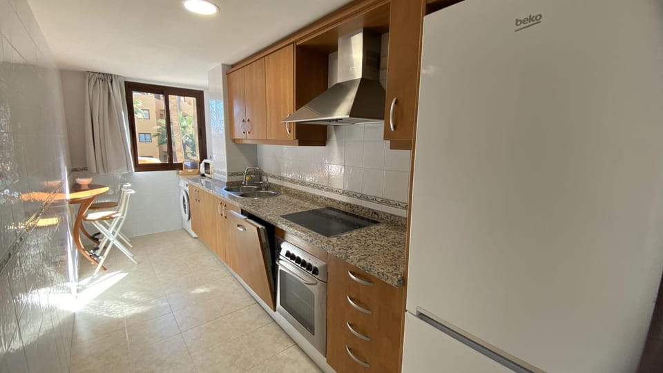 Kitchen or kitchenette, Dining area, dishwasher, oven, stove, toaster, washing machine