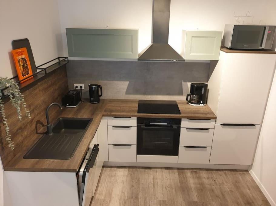 Kitchen or kitchenette, dishwasher, oven, stove, toaster