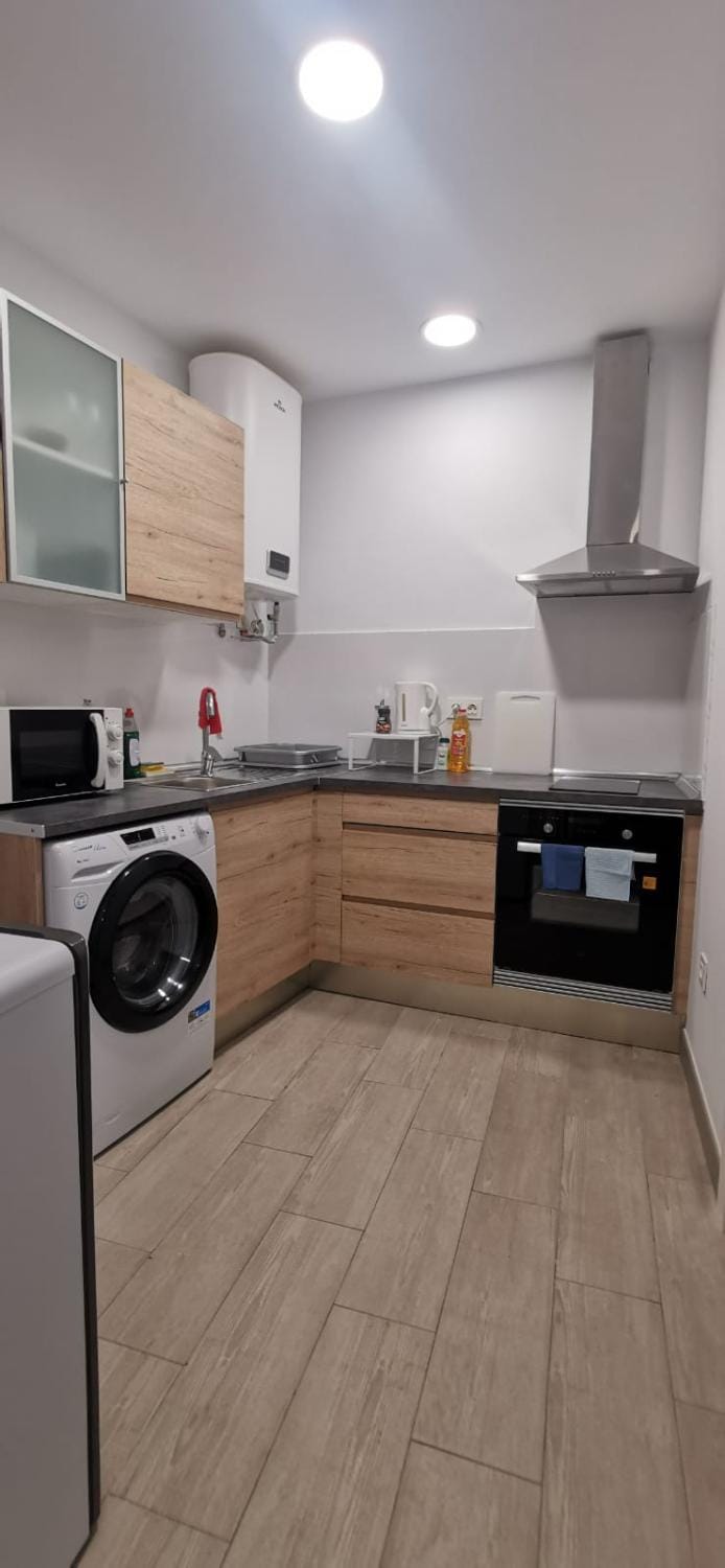 Kitchen or kitchenette, oven, stove, washing machine
