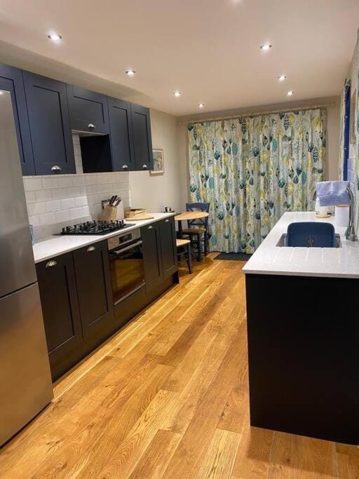 Kitchen or kitchenette, dishwasher, oven, stove